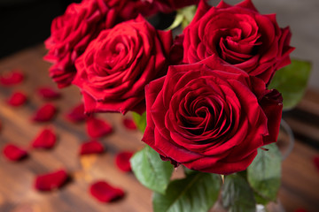 Red roses bunch on the moody background