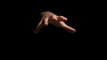 A terrible hand, bent in convulsions, wants to catch something, threaten, scare.Climate lighting. Recorded in 4K 60fps. High-quality recording in a professional film studio.