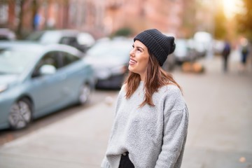 Young beautiful woman smiling happy and confident. Standing with smile on face walking at the city