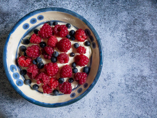 Cottage cheese, yogurt, sour cream with blueberries, raspberry