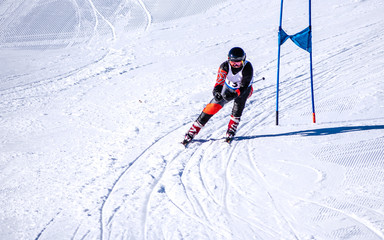 People are enjoying downhill skiing and snowboarding	