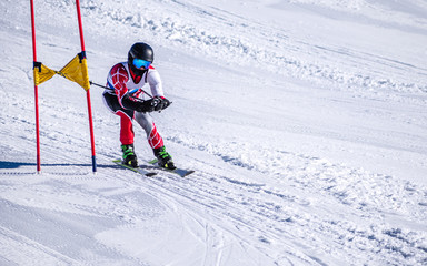 People are enjoying downhill skiing and snowboarding	