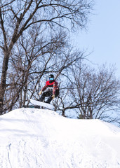 People are enjoying downhill skiing and snowboarding	