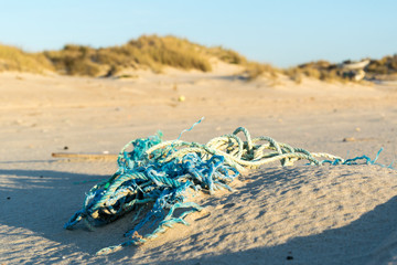 Abandoned fishing net on the beach.