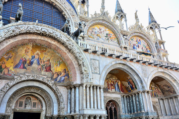 Fototapeta na wymiar Frescoes on facade of Basilica di San Marco,St Mark Cathedral in Venice, Italy