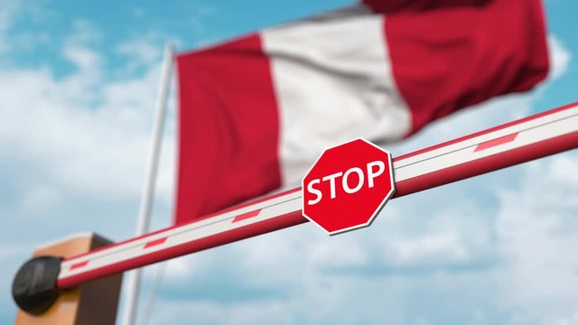 Closing boom barrier with stop sign against the Peruvian flag. Restricted entry or certain ban in Peru