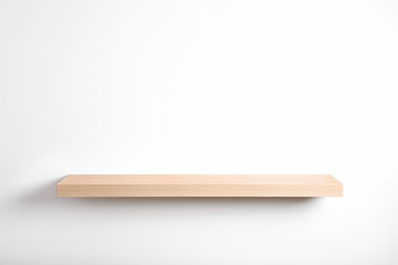 Empty stylish wooden shelf isolated on white