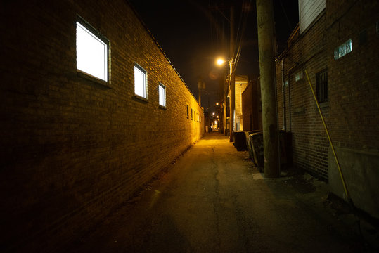 Dark and eerie urban city alley at night  © Bruno Passigatti