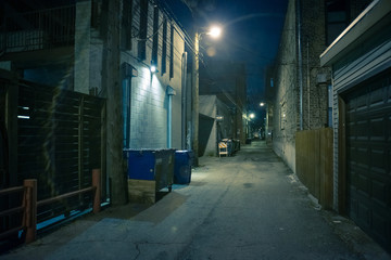 Fototapeta premium Dark and eerie urban city alley at night&nbsp;