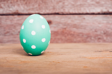 Beautiful Easter Green egg on wooden