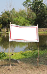 blank white of sign side the pond