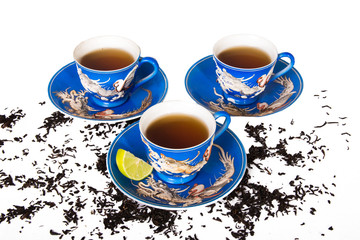 chinese dragon blue tea set on white background with lemons