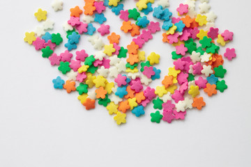 Multicolored Pastry decor in the shape of Chamomiles.