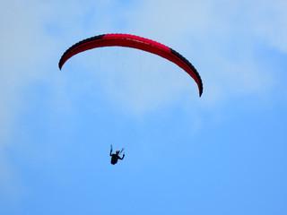 Paraglide flight in blue sky