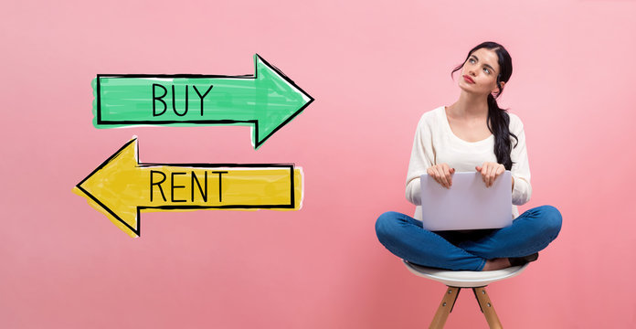 Buy or rent concept with young woman using a laptop computer