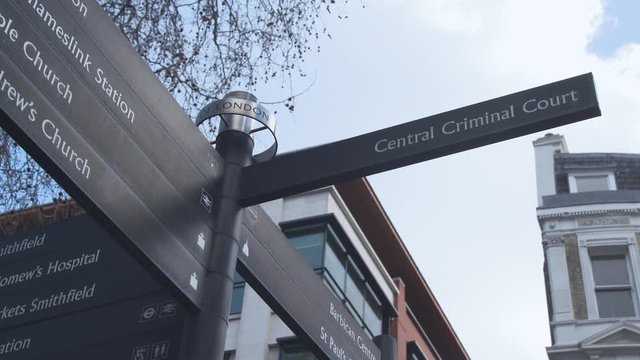 Low angle close up of a signpost for the Central Criminal Court in London