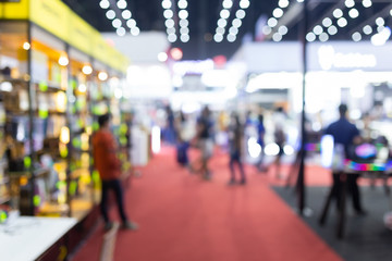 Abstract blur people in exhibition hall event trade show expo background. Business convention show,...