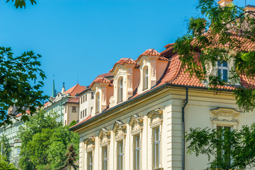 View of the top of old buildings with red roof and blue sky at Prague city Czech republic.