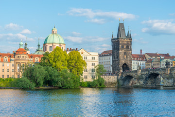 Scenic view of the Old Town pier architecture and Charles Bridge over Vltava river in Prague, Czech Republic