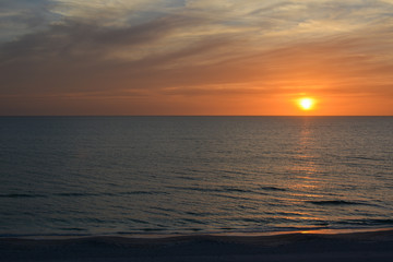 Sunset over the Gulf of Mexico as seen from Florida's tropical Longboat Key beach