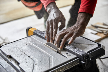 Man cutting Ceramic Tile