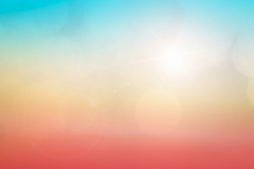 Natural background blurring warm colors and bright sun light. Bokeh or Christmas background Green Energy at sky sunny color orange light patterns plain abstract flare evening clouds blur.