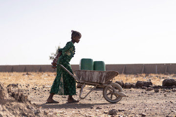 Gorgeous African Girl Working with fresh Water in Bamako
