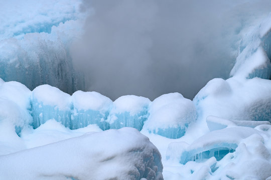 Frozen Geyser. Rock Of Ice With Smoke