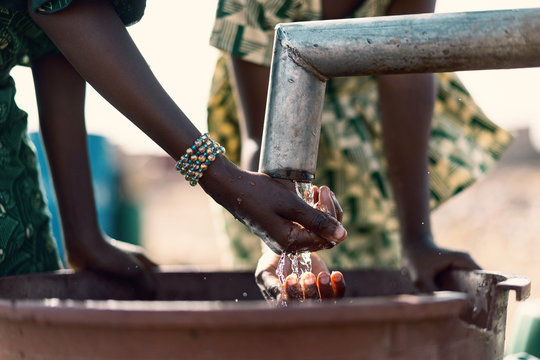 Happy African Girl Collecting Healthy Water With Major Difficulties