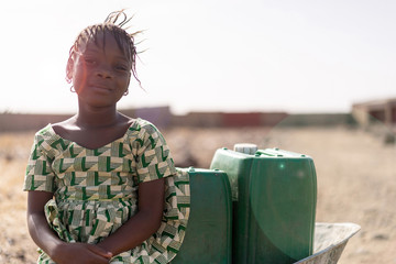 Real African Girl with nutritiousWater for a lack of water symbol