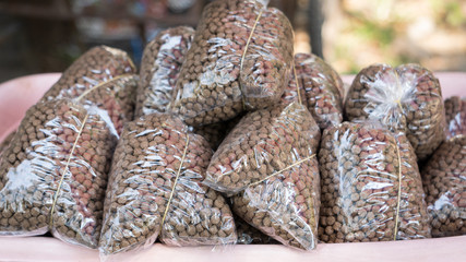 Many bird food in bags that are sold at the beans shop.