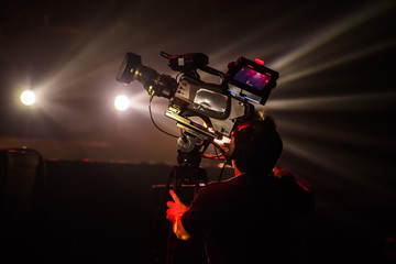 cameraman with headphones with HD camcorder