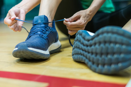 Healthy lifestyle..A young women Tying sports shoe for fitness training. Sport, exercise workout. © byjeng