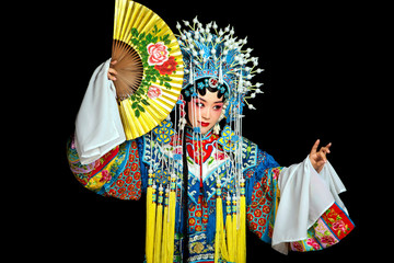 Asian Peking opera actor waving a paper fan performance on black background