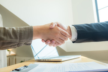 Successful Handshake in Presenting Resume for Work in the Company.