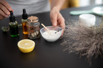 Young lady preparing ingredients for homemade face mask