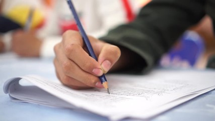 Evaluation or measurement concept. Student testing in exercise taking fill in exam at school or university in test room, writing document exams paper at campus classroom, education back to school idea
