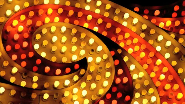 Stock video  flashing red and yellow marquee spiral