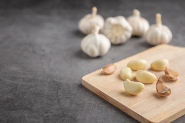 Garlic on the black table. High angle view.