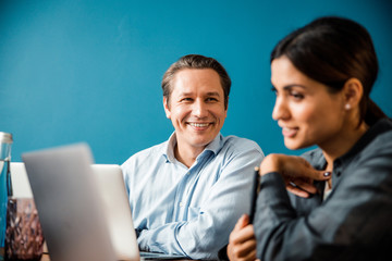 Positive delighted young people discussing their tasks