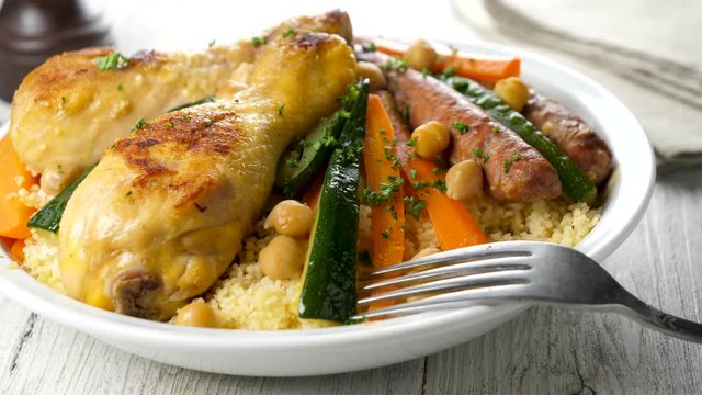 couscous with vegetable, sausage and chicken leg