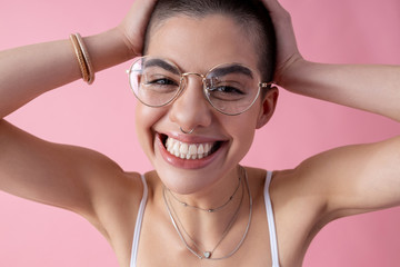 Excited lovely lady smiling and touching head stock photo