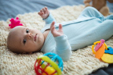 Baby in pajama looking cute and curious stock photo