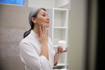 Adult woman enjoying beauty procedures at home stock photo
