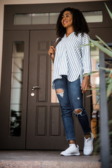 American lady with curly hair going for walk