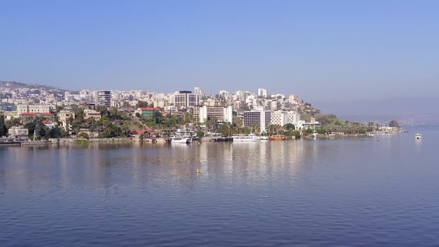 Aerial footage of Tiberias, Israel. with the sea of Galilee on a clear day.