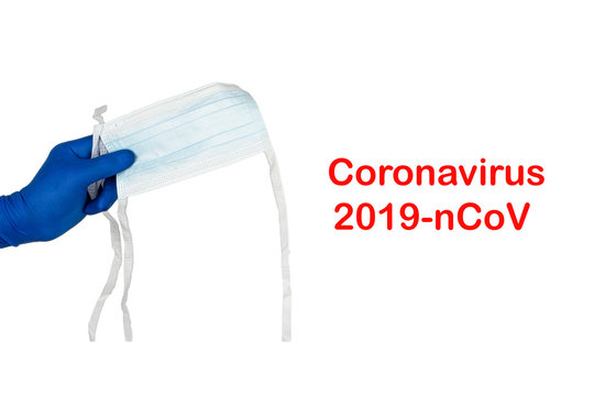 CORONAVIRUS 2019 NCOV text and hands holding protection mask on white background. Healthcare and copy space concept