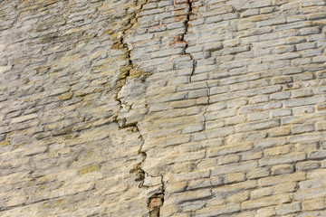 Old brick wall with big crack