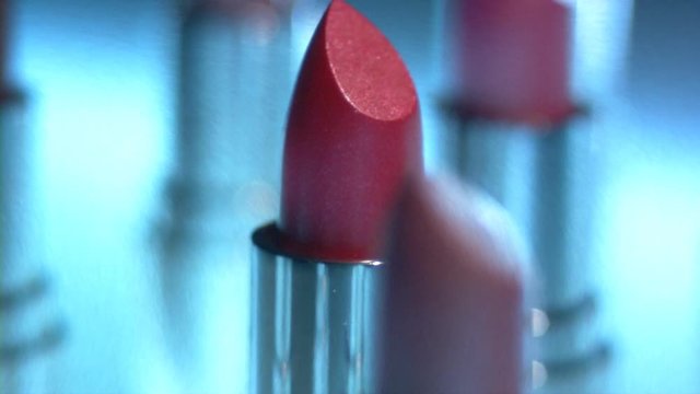 Red lipstick on the glass table Beautifully