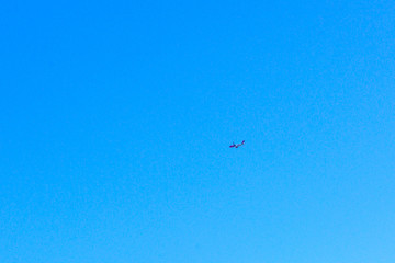 Commercial passenger airplane in the blue sky